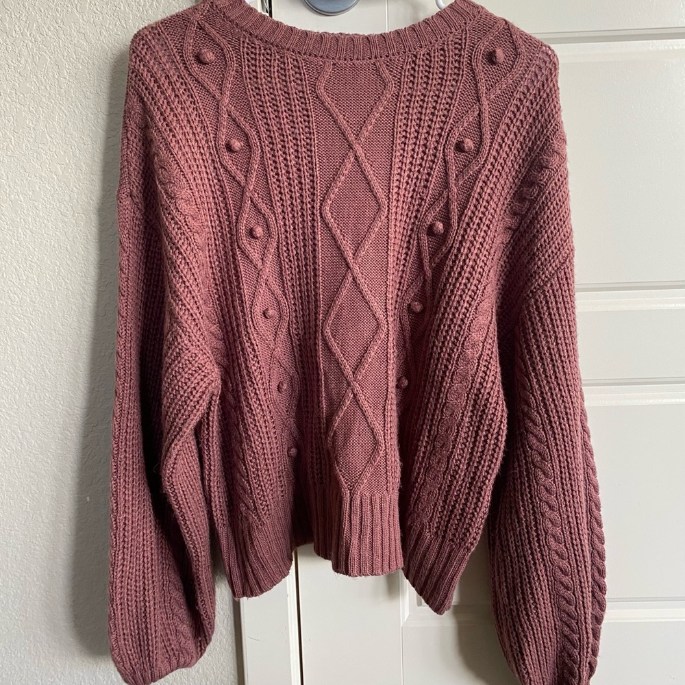 Purple sweater with designs